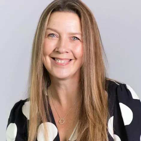Elaine Bryce wearing black top with white spots