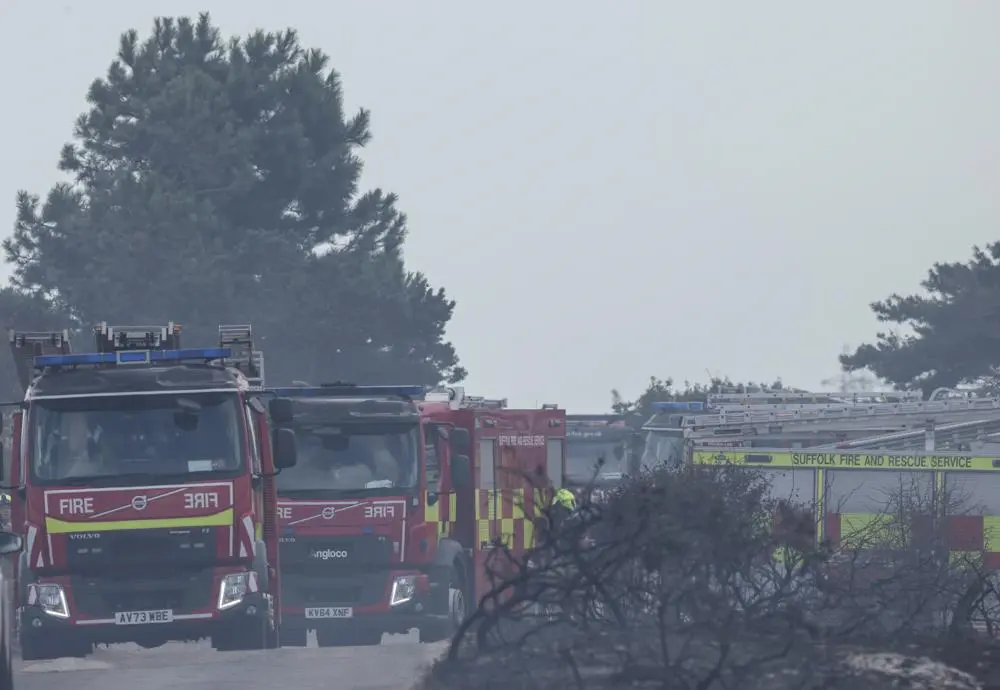 four appliances parked in burned out heathland