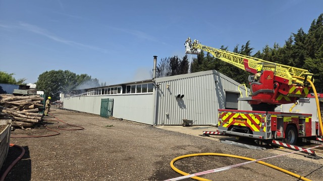 Turntable ladder from Bury St Edmunds in use to provide access to the middle of the workshop
