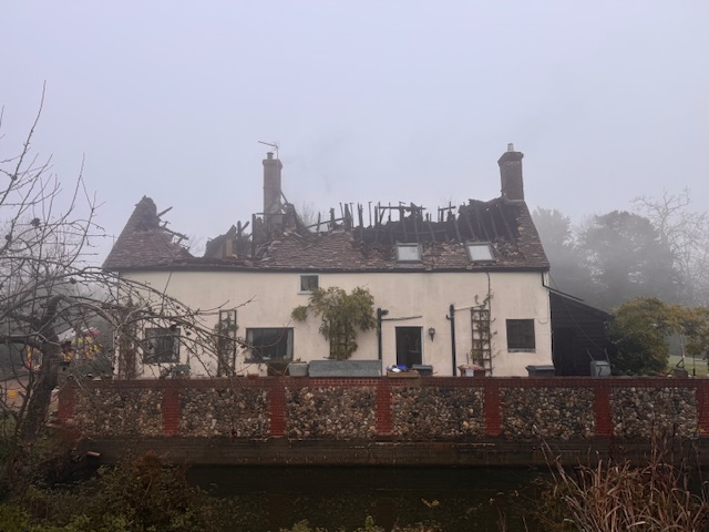 The damage caused by the fire as seen from the side of the property. 