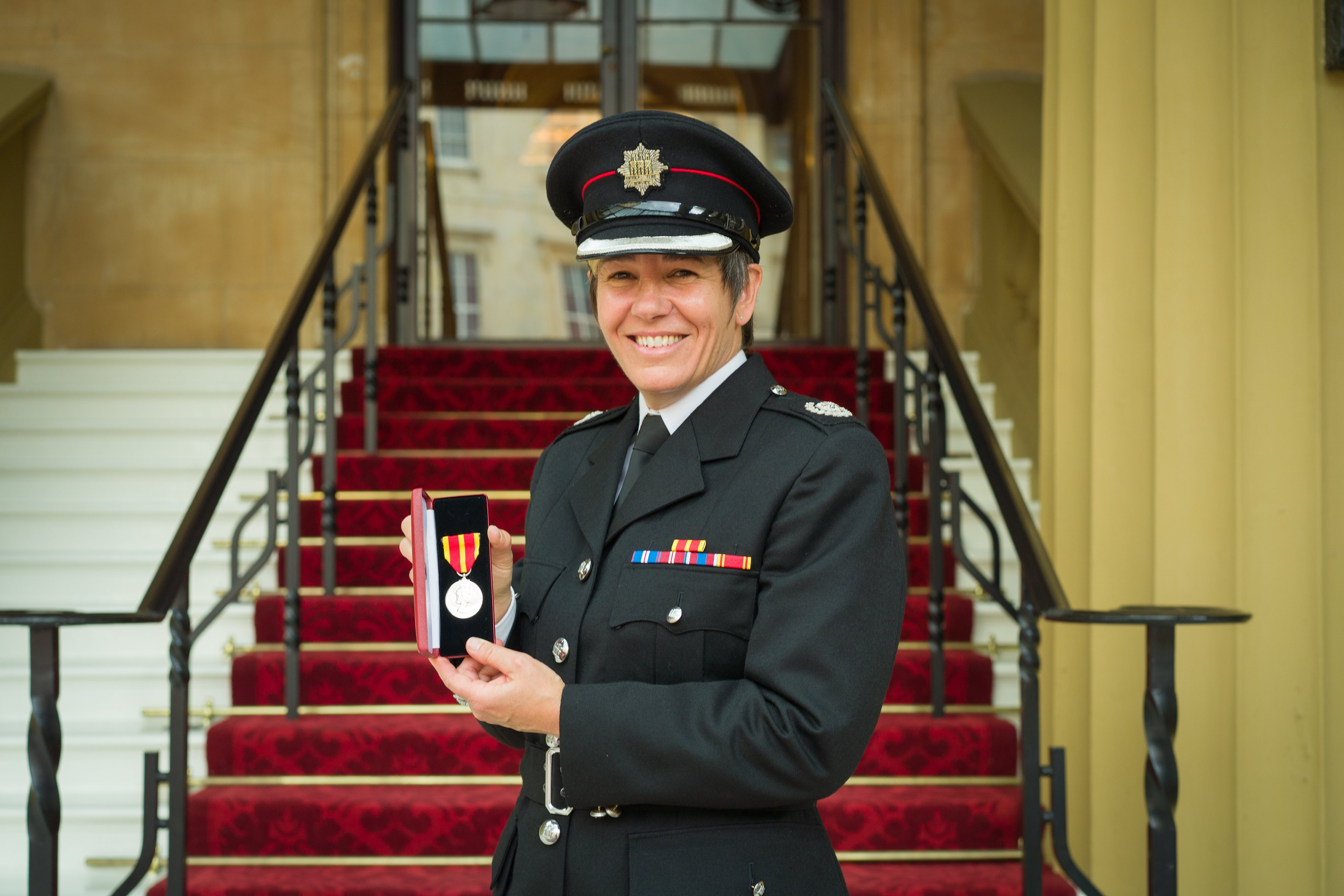 Sally Hammond receiving the Queen's Fire Service Medal for Distinguished Service
