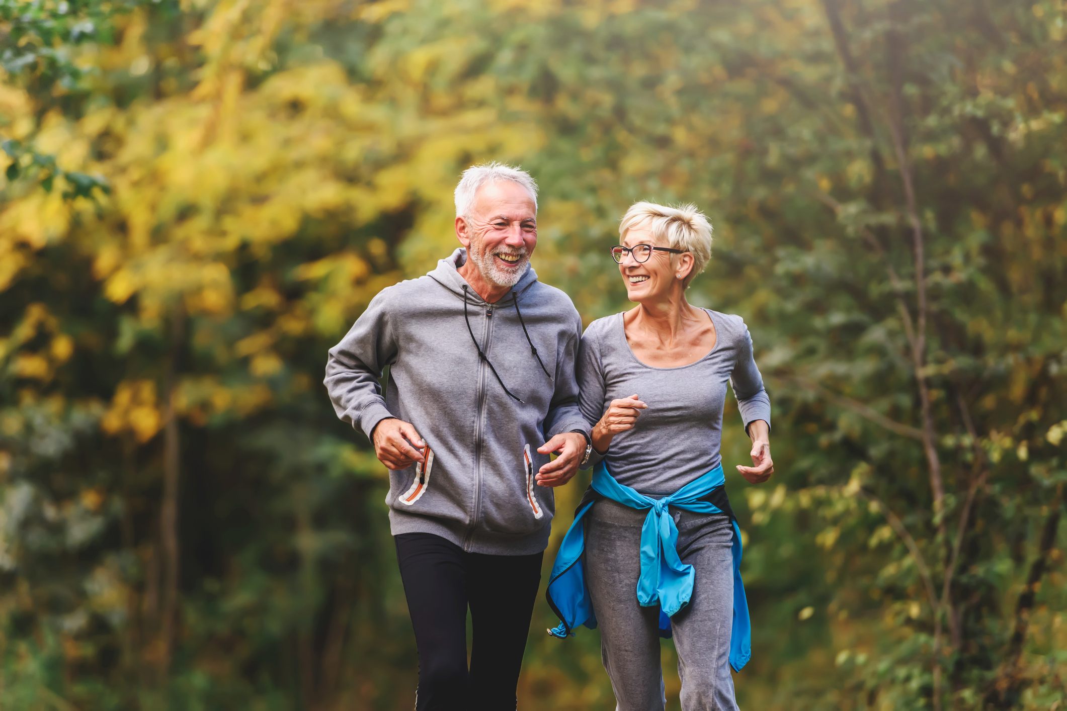 Two older people jogging 