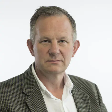 Image of Andy Mellen wearing suit jacket and white shirt