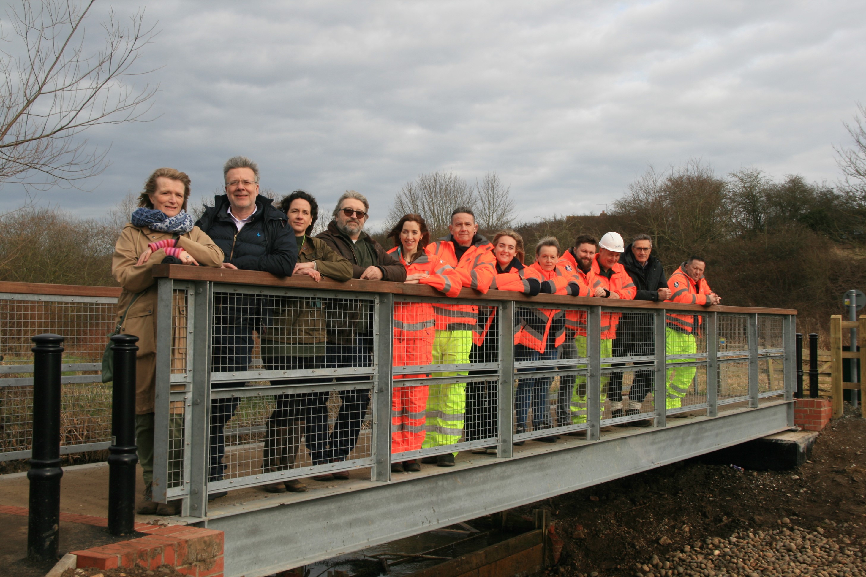 People on the new Blyth Bridge at Halesworth's Millennium Green.