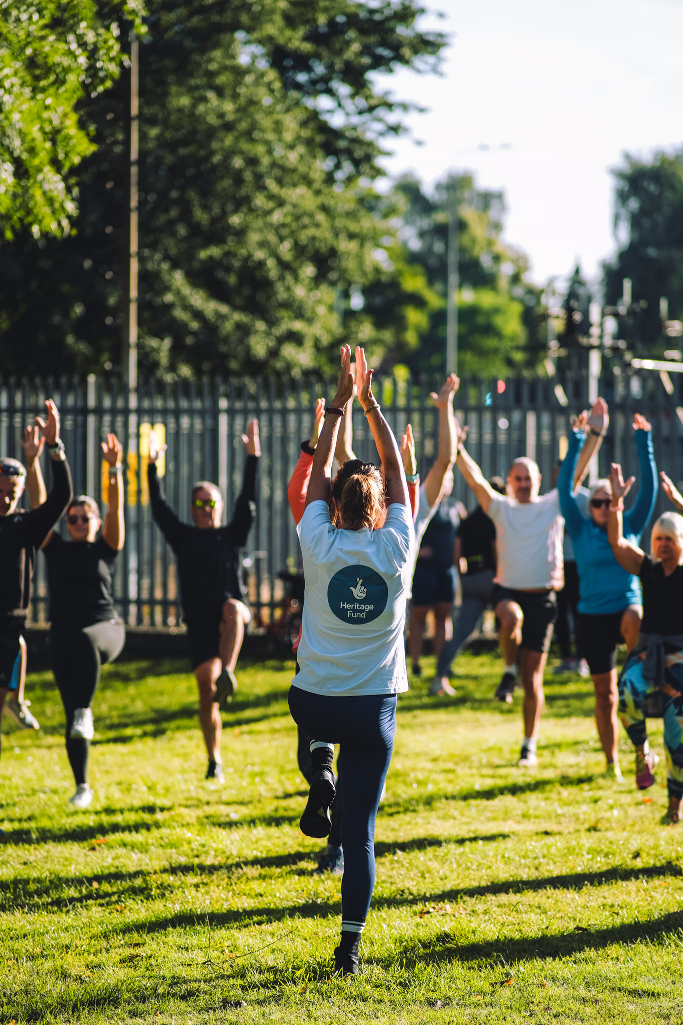 people doing outdoor yoga