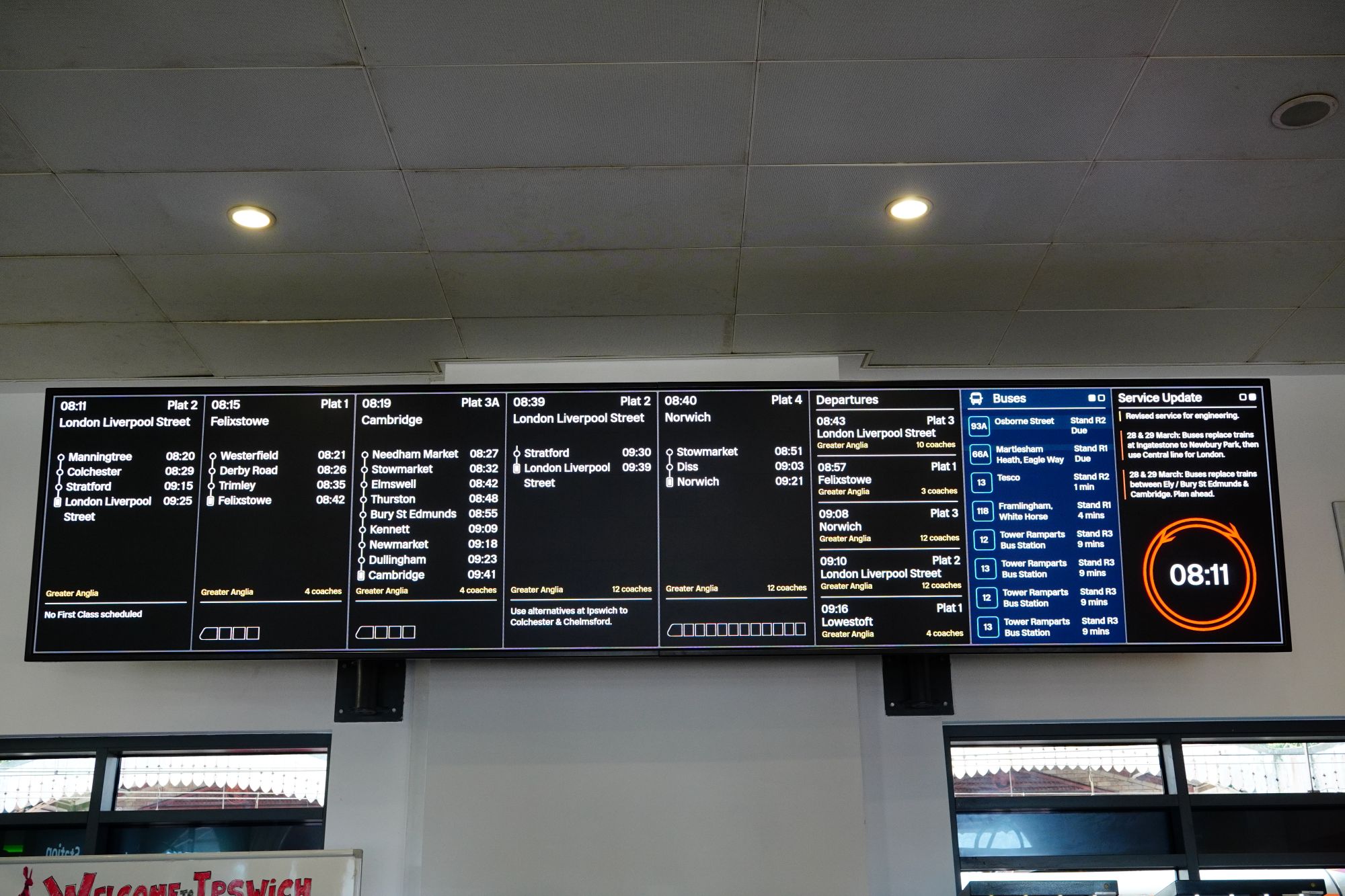 An electronic railway and bus timetable information board.