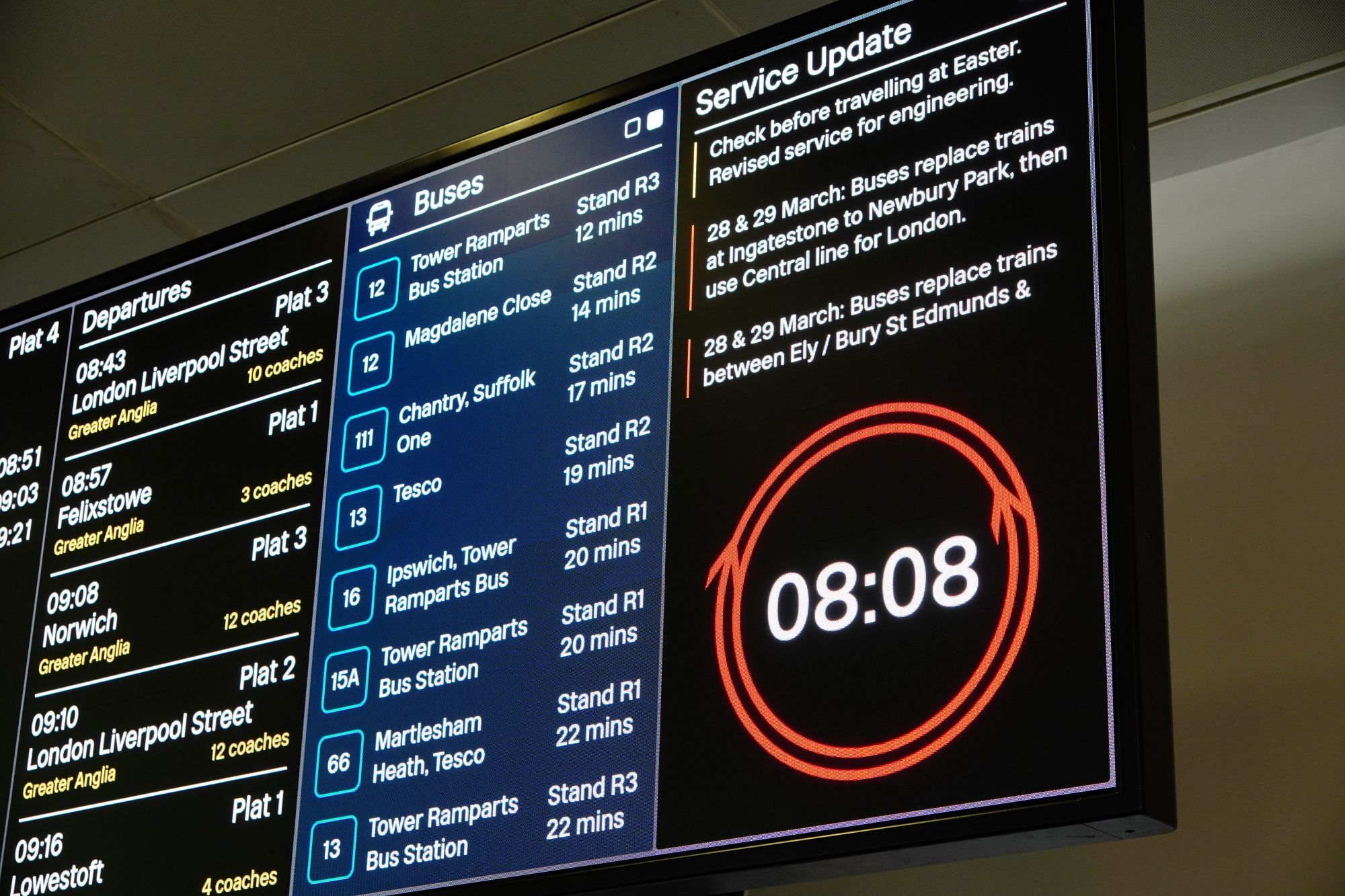 An electronic rail and bus timetable information board