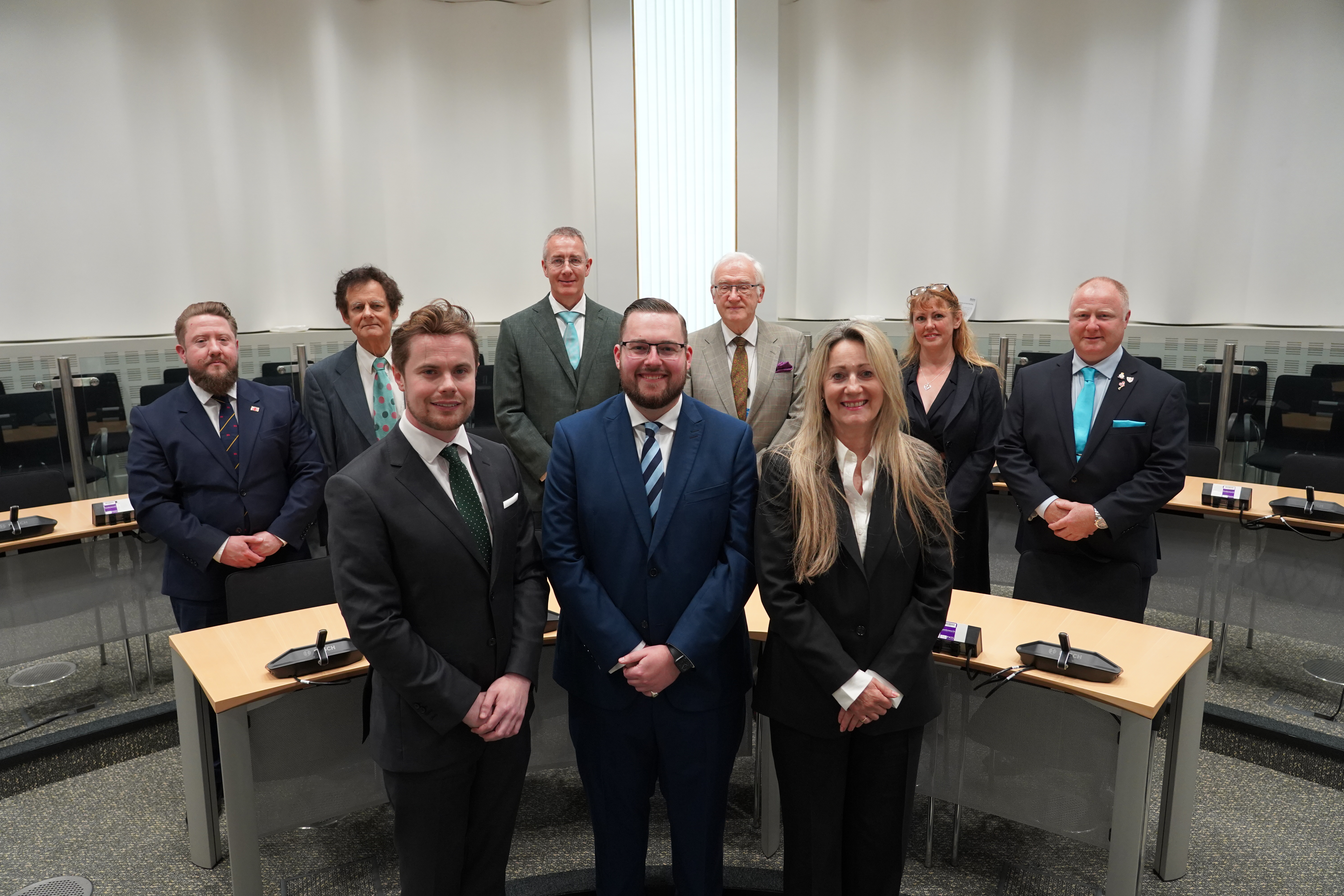 Suffolk County Council cabinet members, standing in the council chamber ahead of the annual general meeting