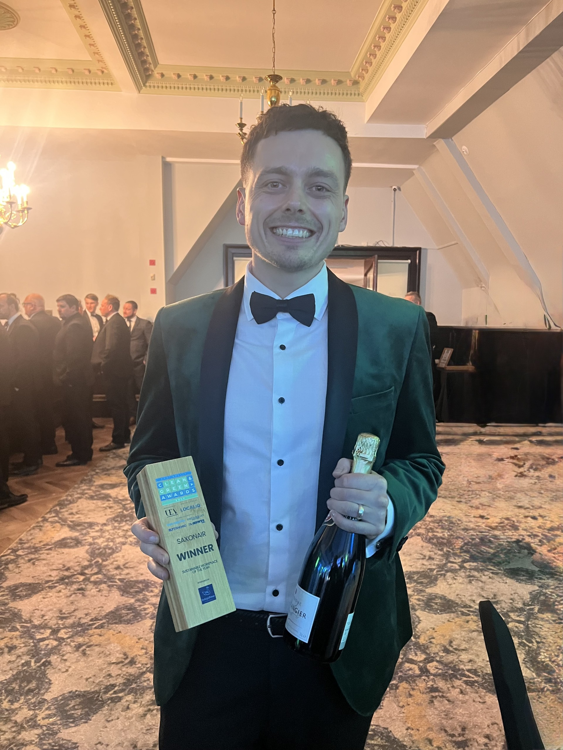 Cameron Saunders holding his award