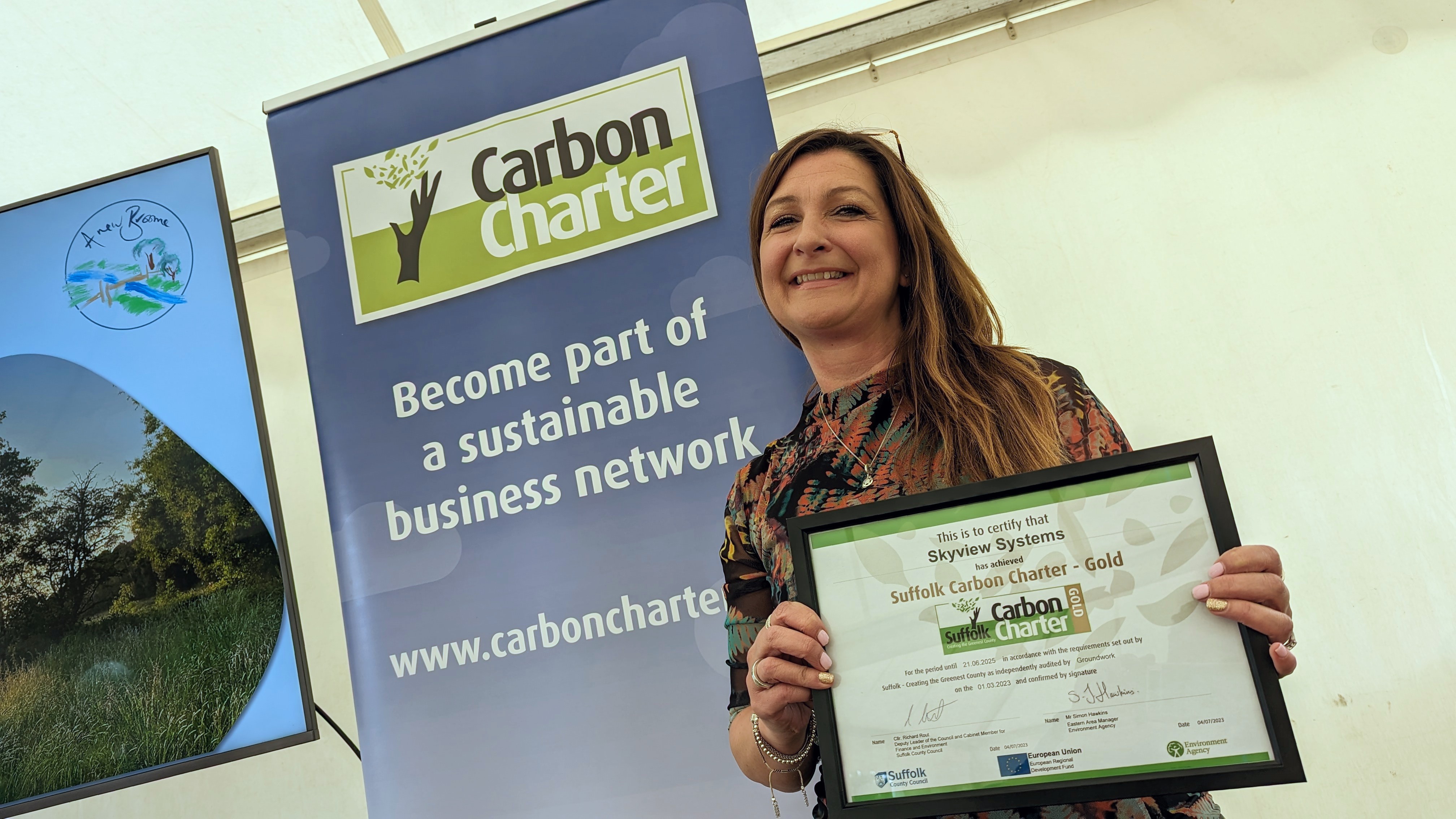 Lori Hunt poses with her Gold award certificate