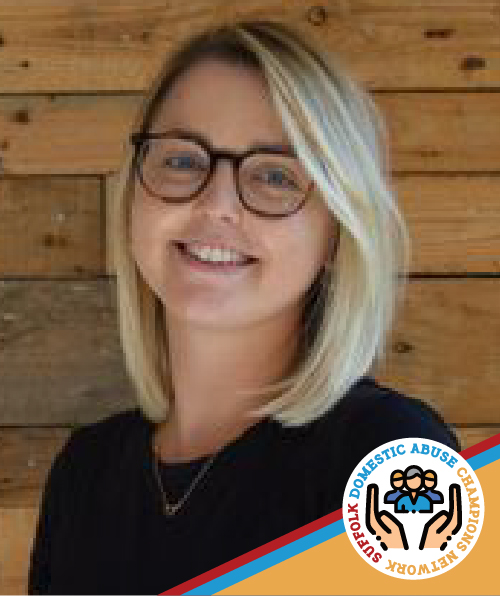 Portrait image of Chloe smiling and wearing glasses.