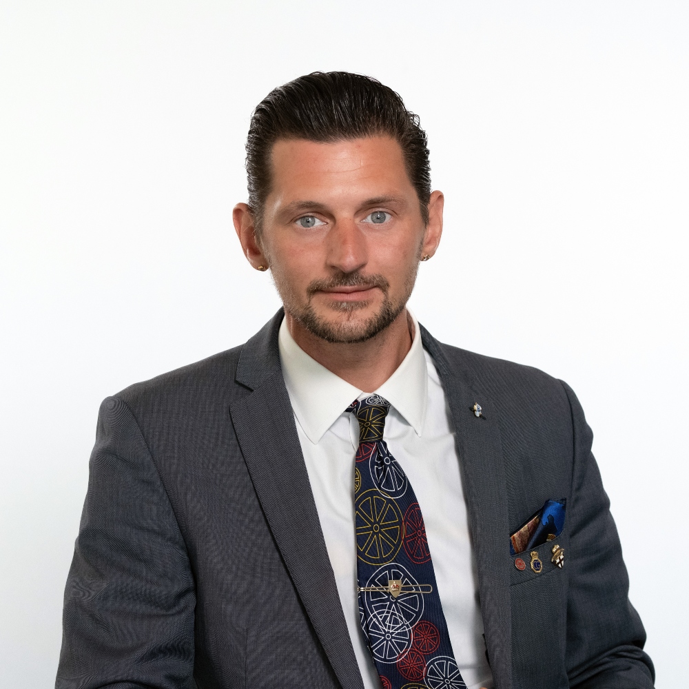 Cllr Chris Smith wearing suit and tie 