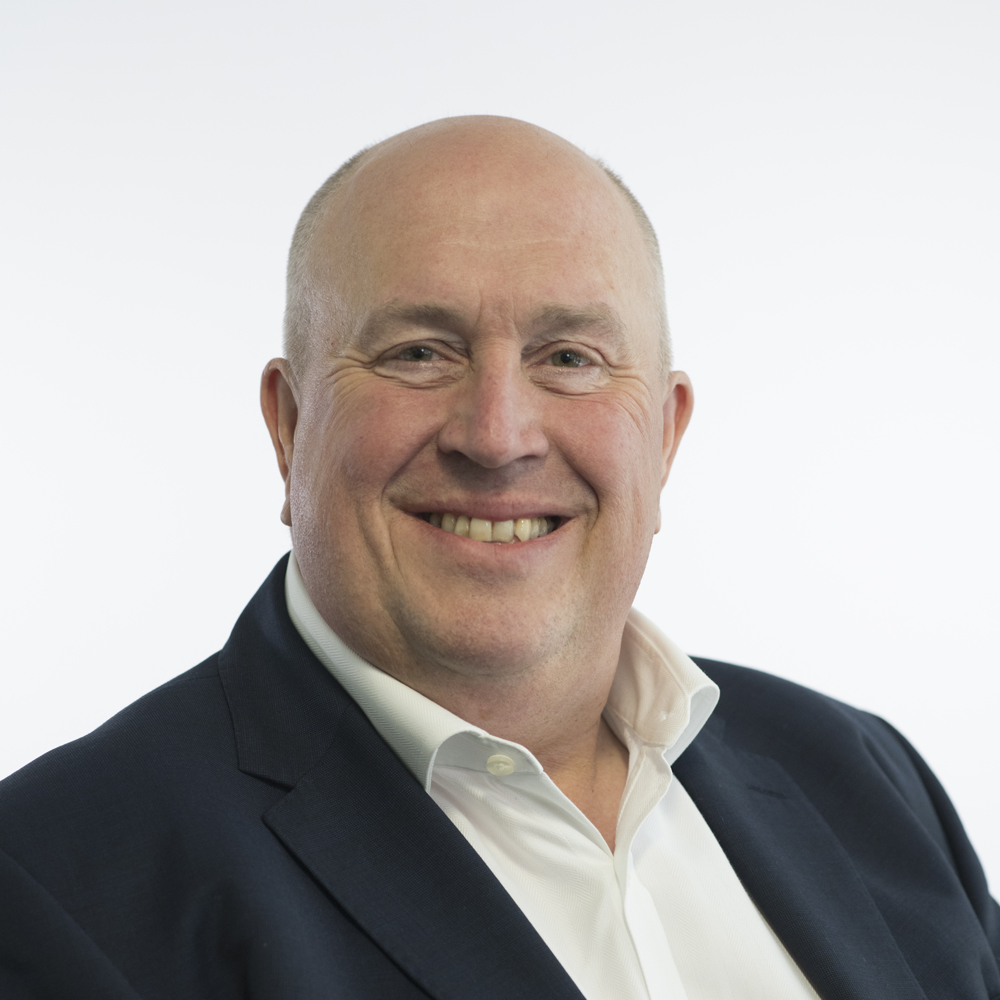 Colin Noble, Councillor, wearing a dark suit jacket and white shirt