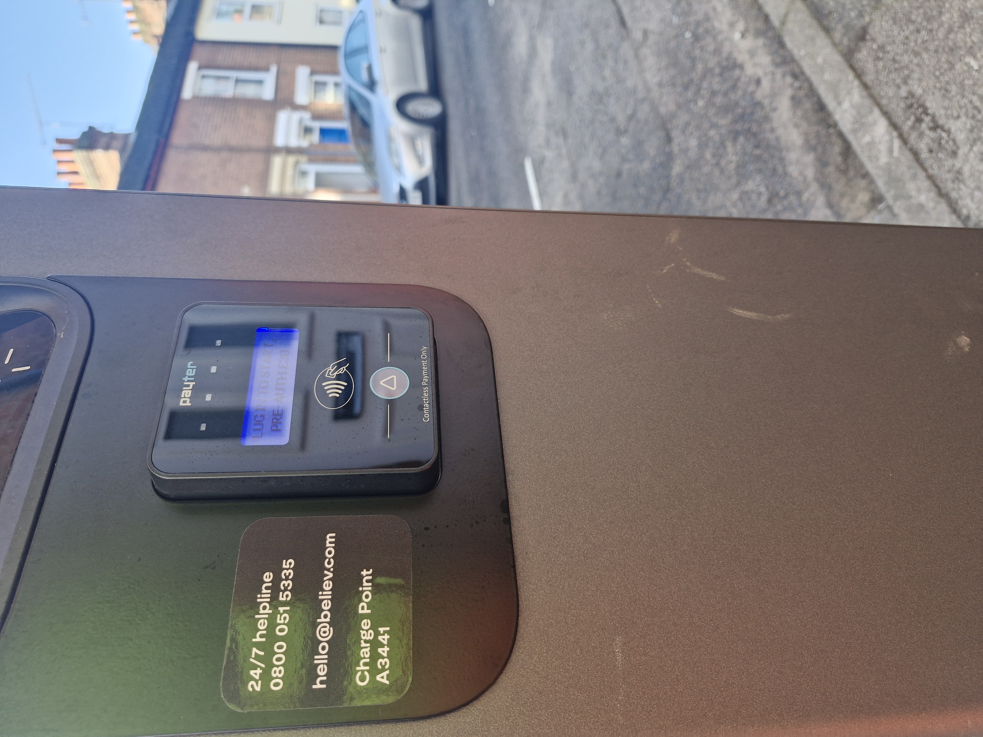 A zoomed in image of a  chargepoint, with a close up of the contactless payment system.