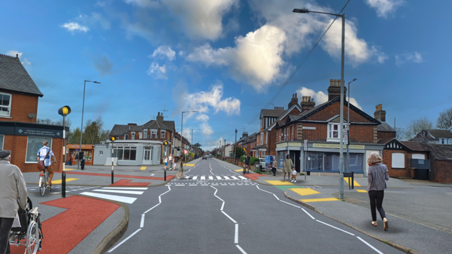 A high street with several people walking along the path