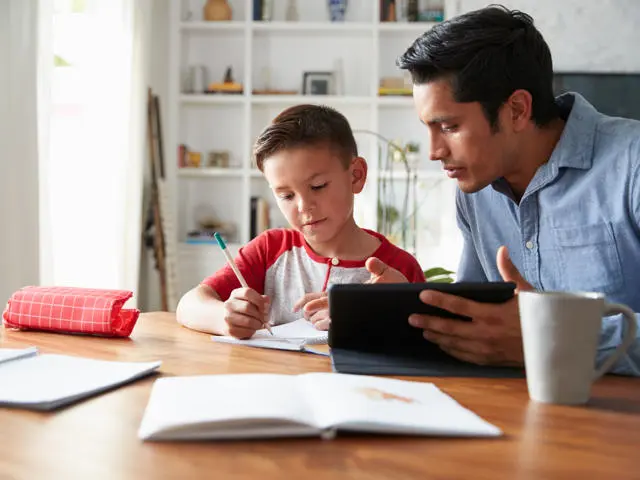 Father and son learning at home