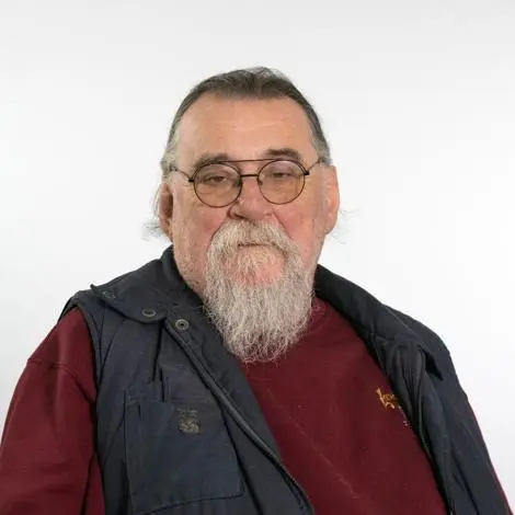 Councillor Don Waldron wearing black gilet and red jumper