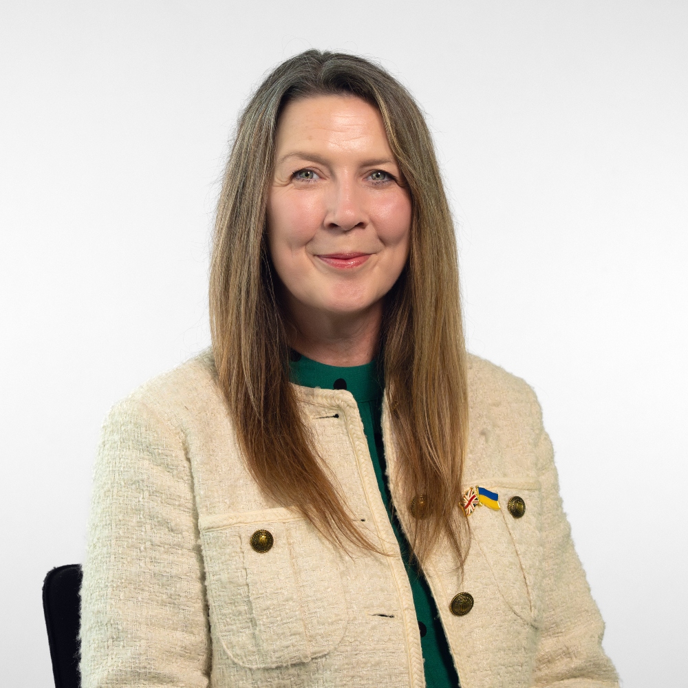Councillor Elaine Bryce wearing a cream jacket and green top smiling