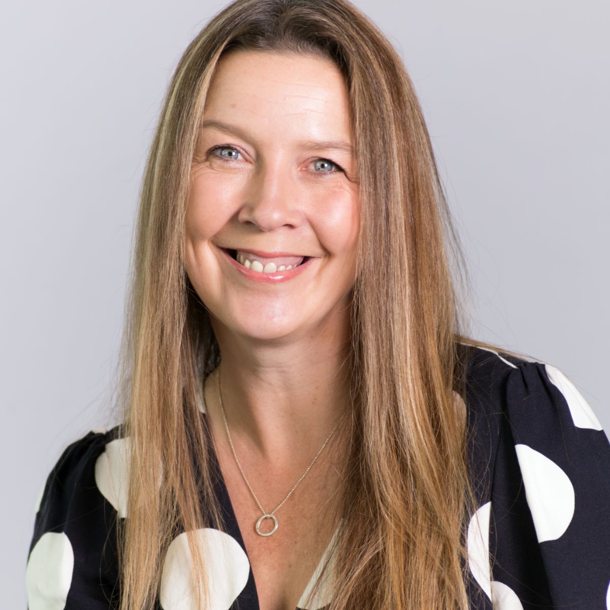 Elaine Bryce wearing black top with white spots