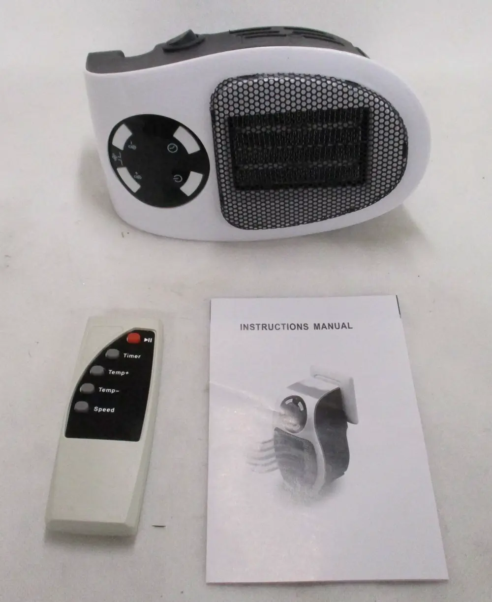 An electric fan heater, remote and instructions manual.