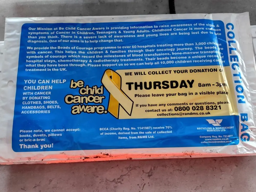 A fake charity collection bag using Be Child Cancer Aware branding.
