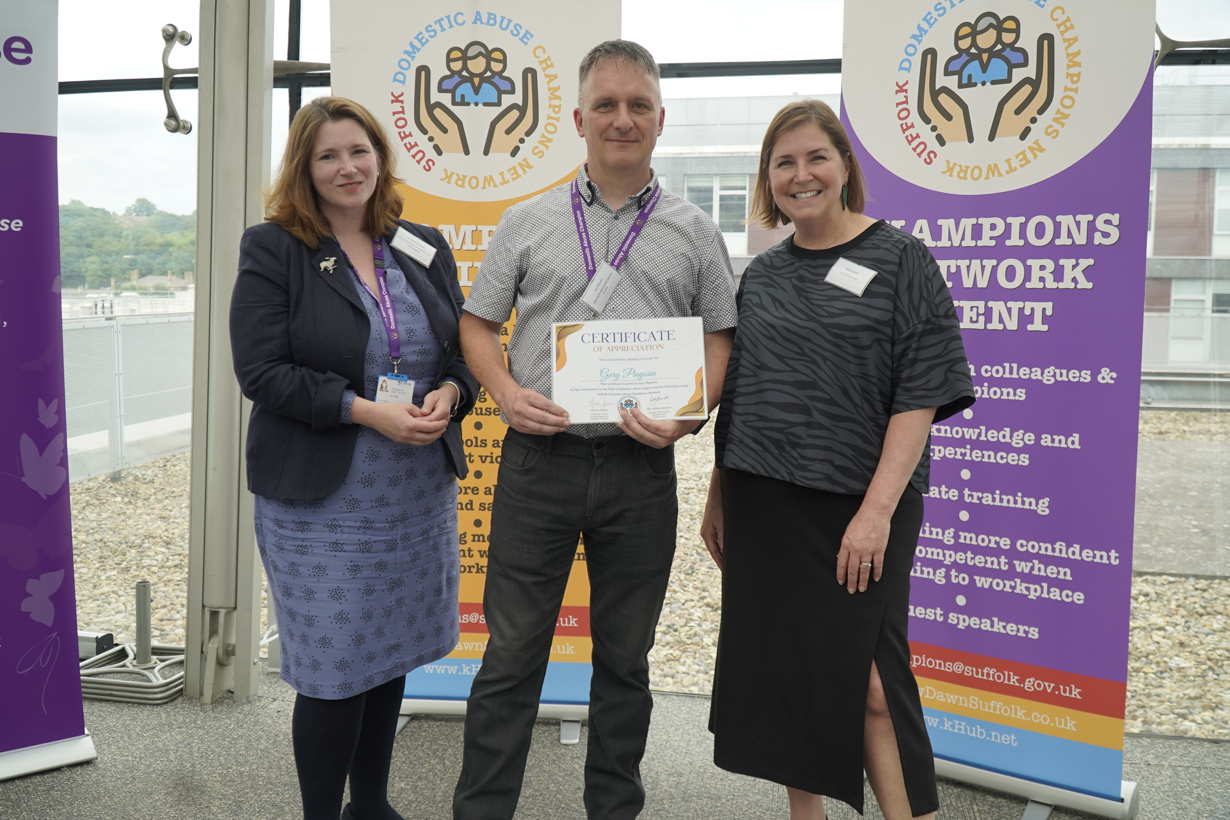 Cllr Bobby Bennett and Nicole Jacobs presenting a certificate to Gary Pinyoun