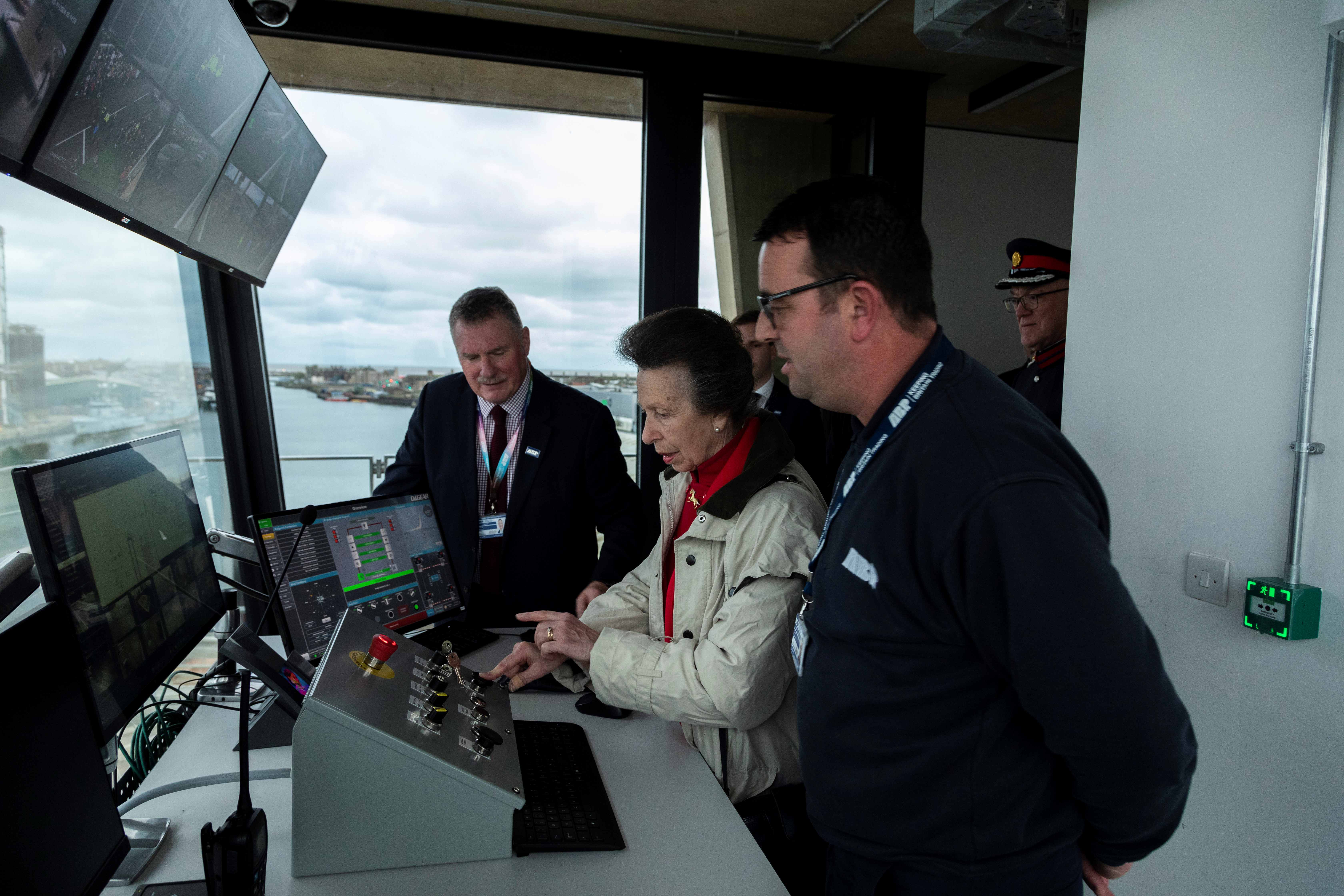HRH in the control room with staff