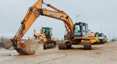 Heavy machinery and lorries in a construction yard