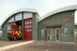 A photograph of Newmarket Fire & Police Station with a fire appliance on show.