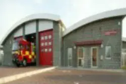 A photograph of Newmarket Fire & Police Station with a fire appliance on show.