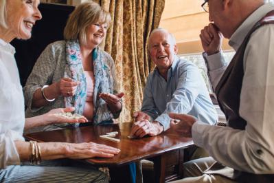 Group playing dominoes at a social club