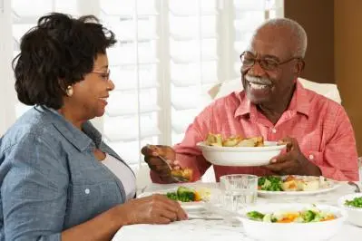 Older couple sharing a meal together