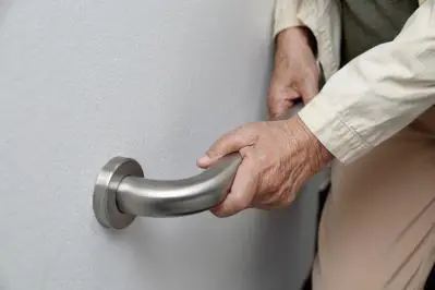 Older person using grabrail at home