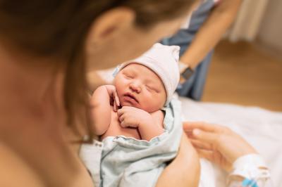 woman holding baby in her arms