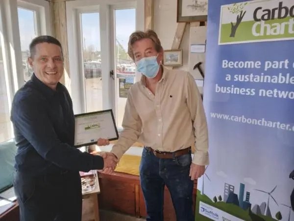 Adrian Turner, owner of Yum Yum Tree Fudge shakes hands with Dan Tarrant-Willis