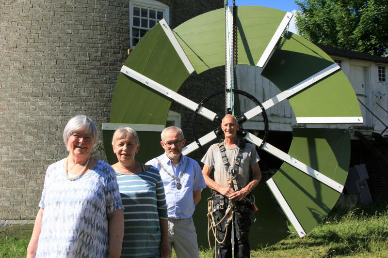 Photo of councillors and millwright in front of Buttrum's Mill