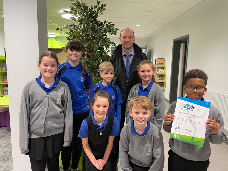 Headteacher and pupils from Thurston Primary celebrate their award.