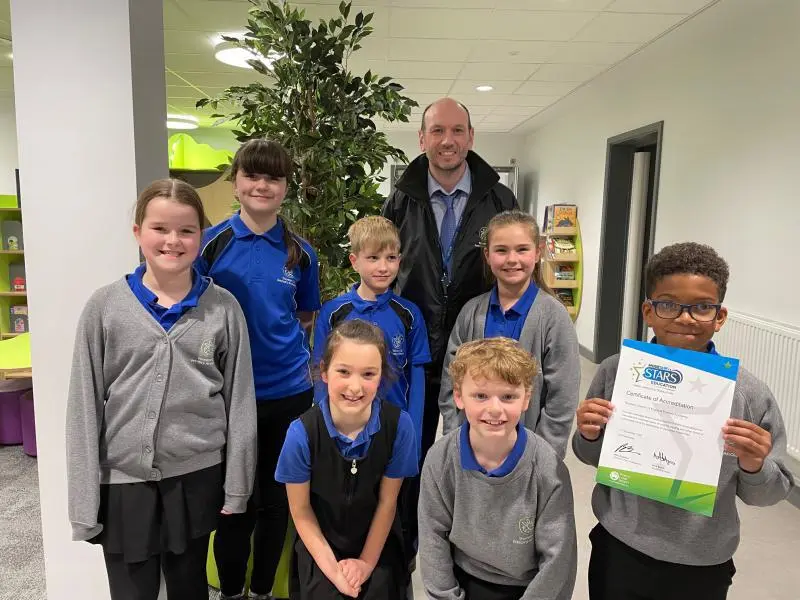 Headteacher and pupils from Thurston Primary celebrate their award.