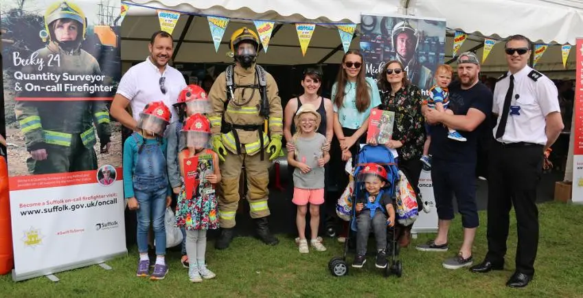 Families and staff pose for a photo at the Suffolk Show