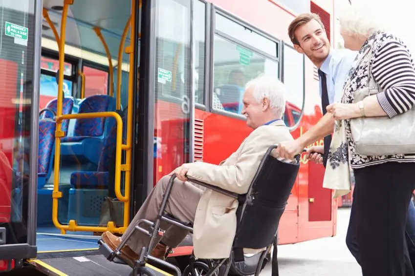 Wheelchair user getting on a bus