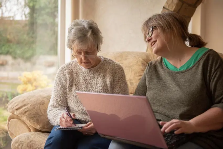Woman and her mother using a laptop