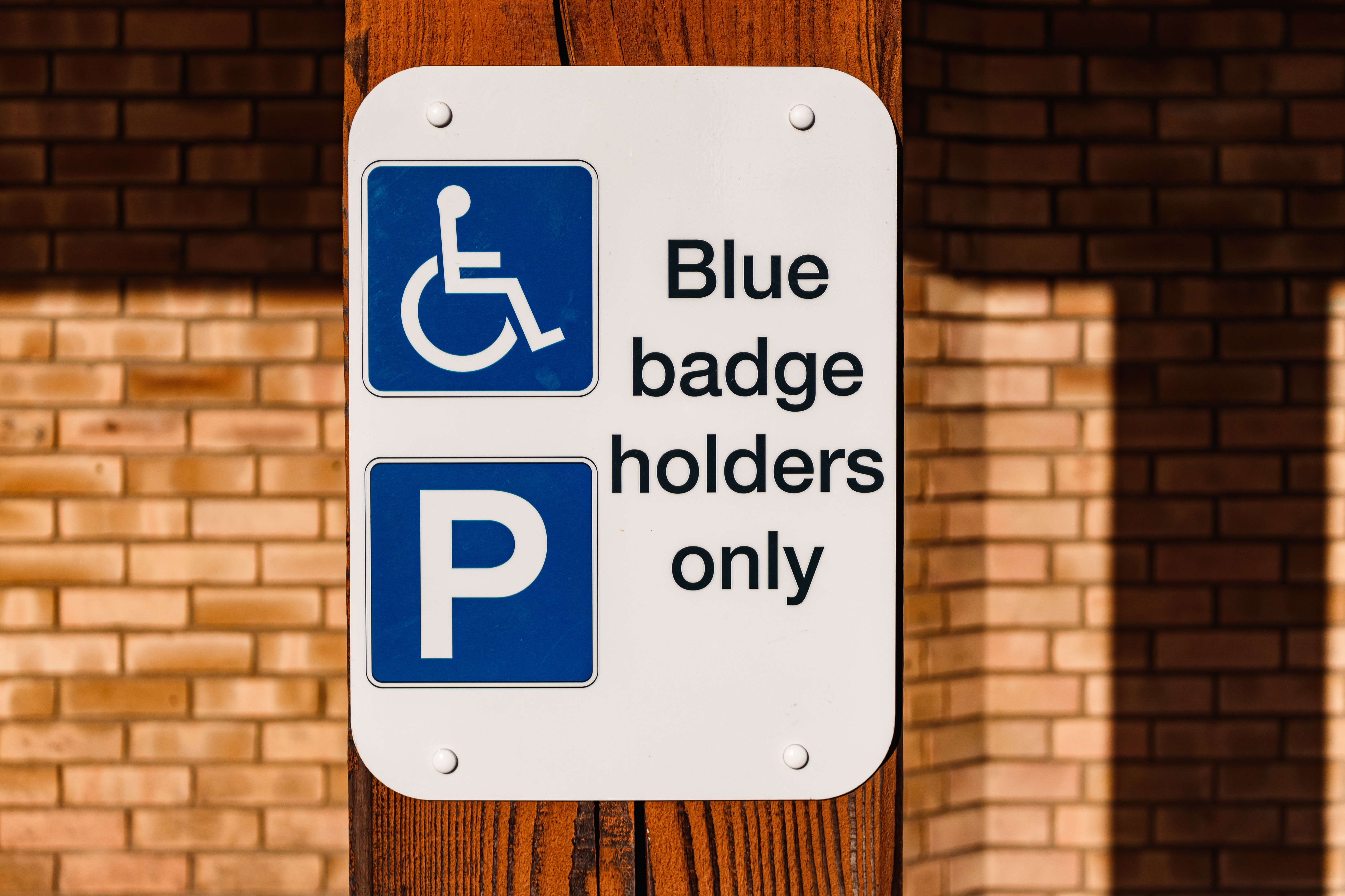 Blue badge holder only sign.