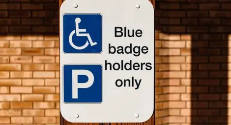 Blue badge holder only sign.