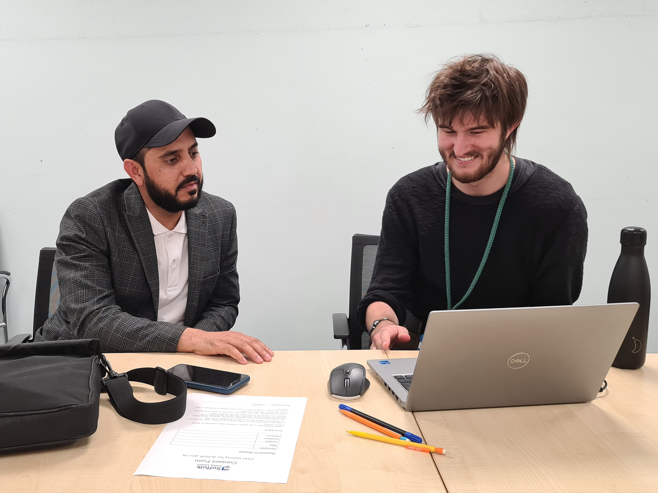 James from the project team doing user research with Danish from Suffolk Refugee Support