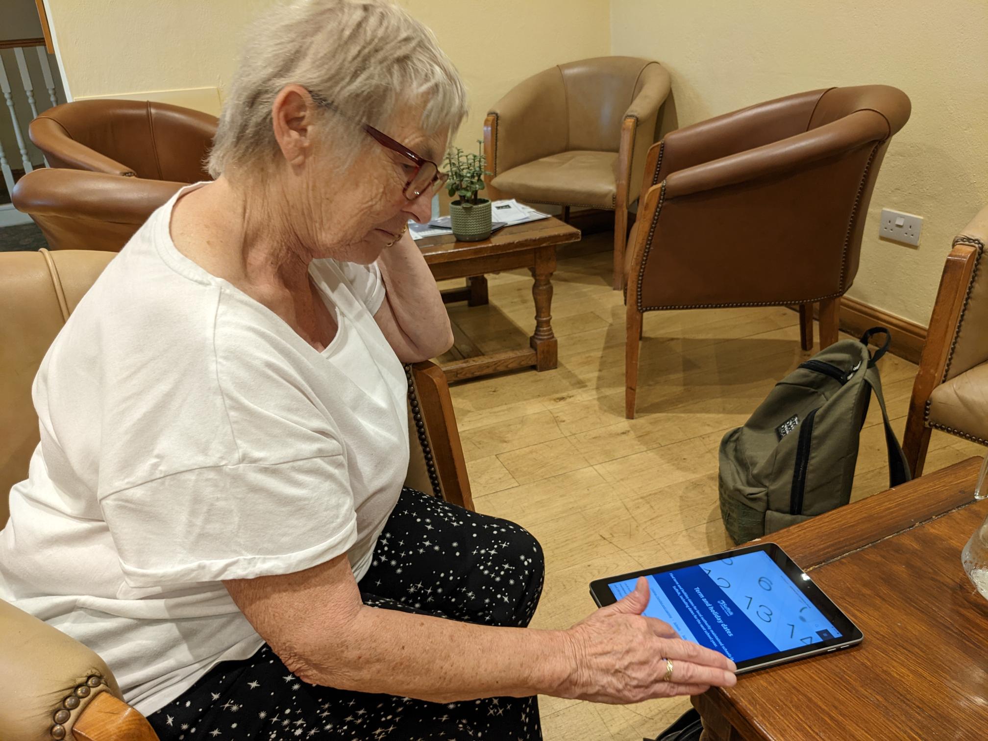 Joan testing our new website with her tablet during user research