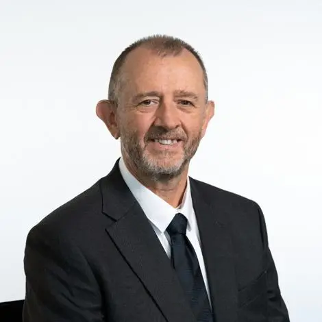 Cllr Joe Mason waring black suit, white shirt and tie