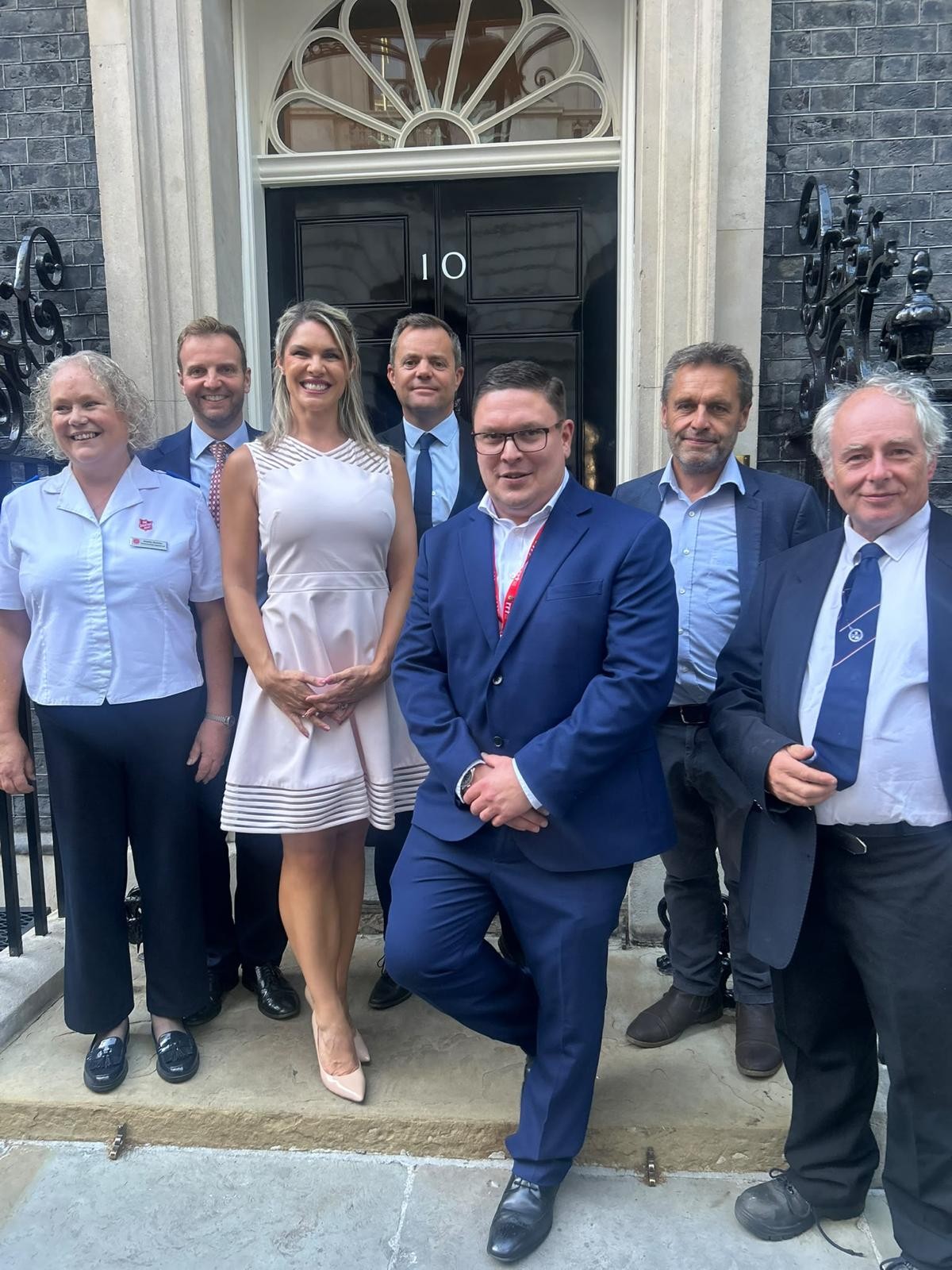 Jon Lacey, Suffolk's Chief Fire Officer and representatives of organisations who led the response to the Dunwich Heath fire standing outside Number 10