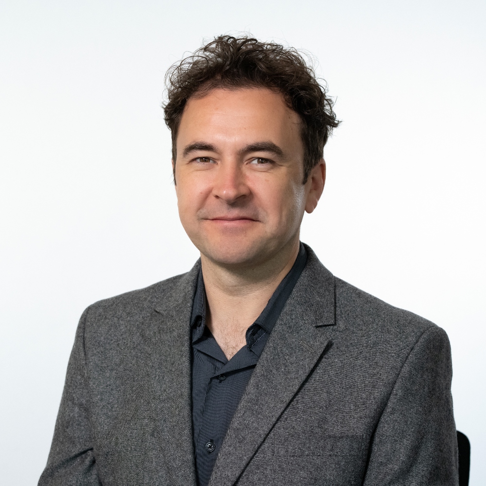 Councillor Jonathan Ramsay wearing grey jacket and black shirt