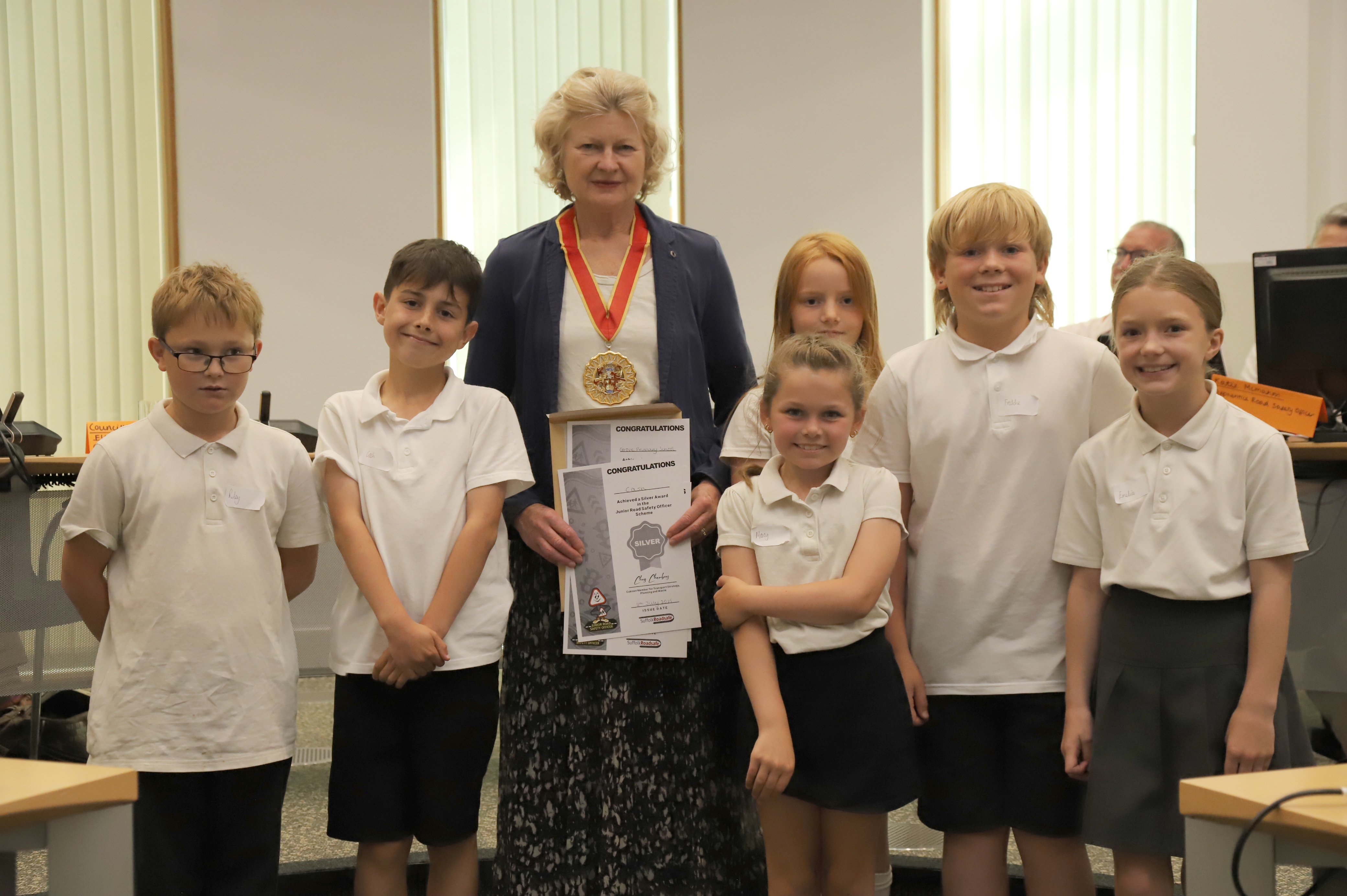 Councillor Jessica Fleming with six children and their certificates.