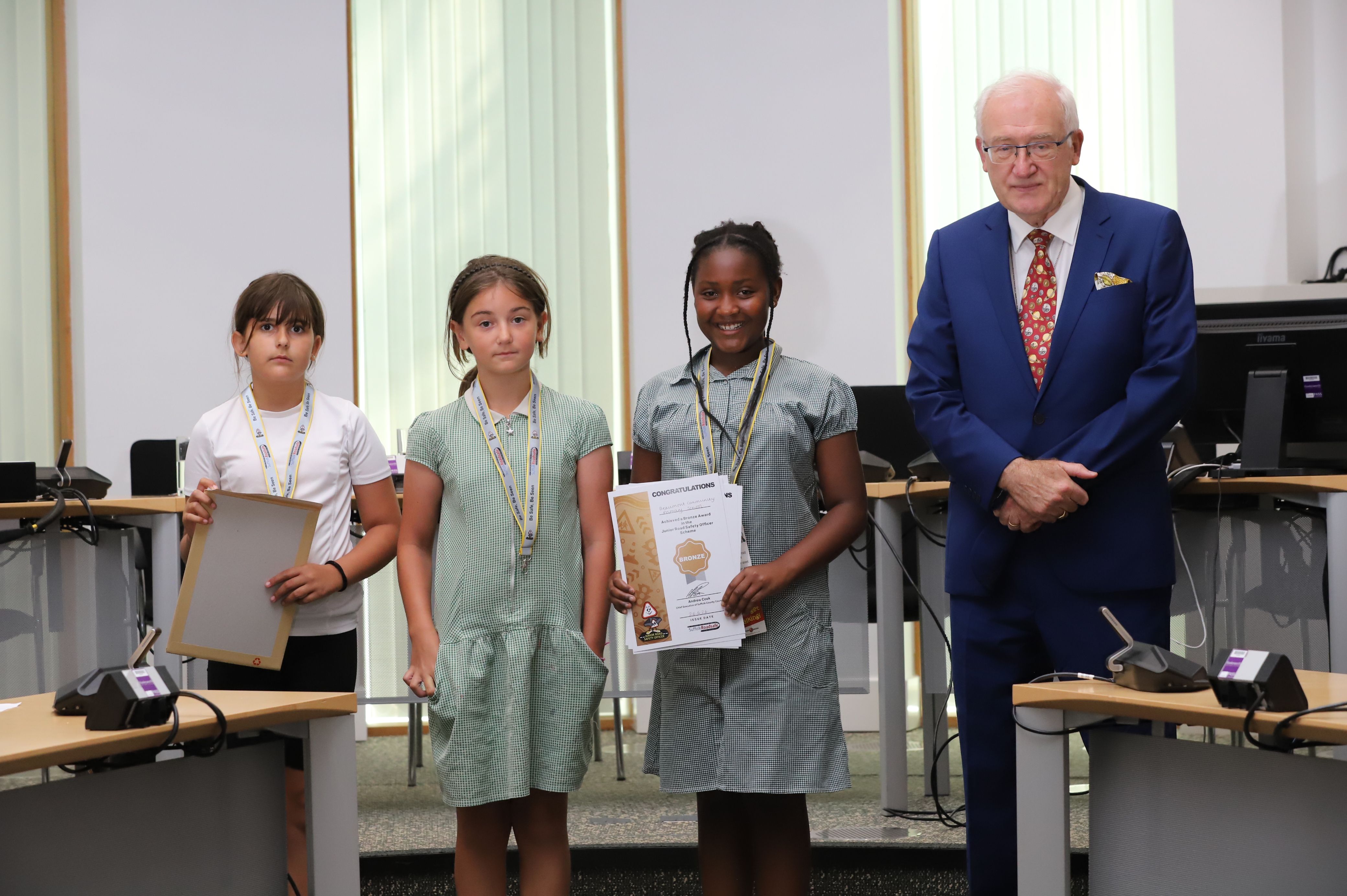 Three pupils with Councillor Christopher Hudson
